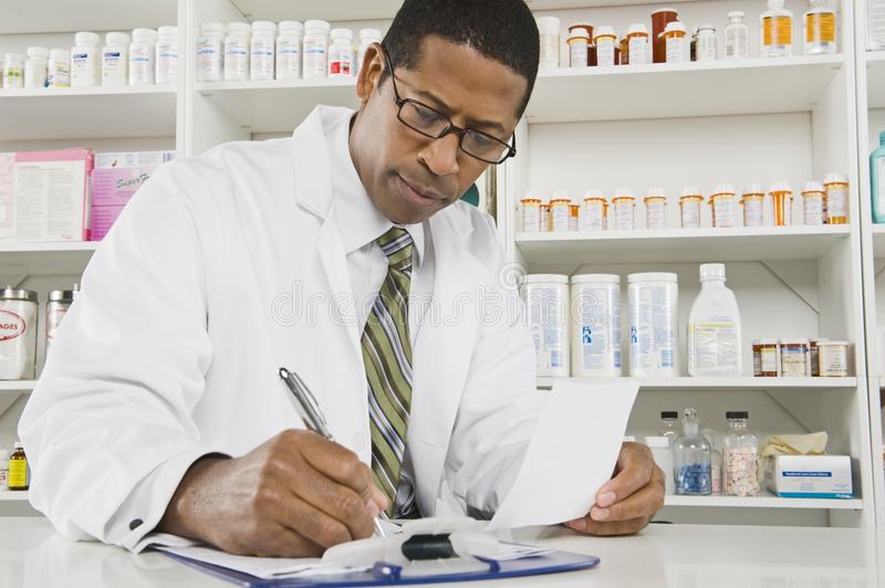 male-pharmacist-working-pharmacy-29665936